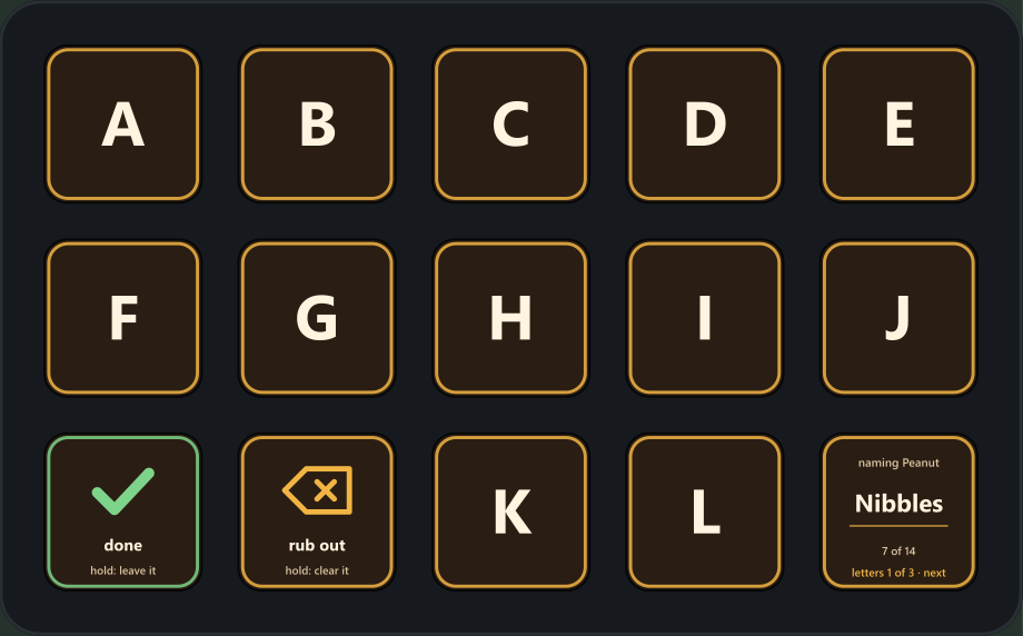 A Stream Deck showing the naming page: the letters A to L on the keys, a done key with a green tick, a rub out key, and a corner key with the name so far.
